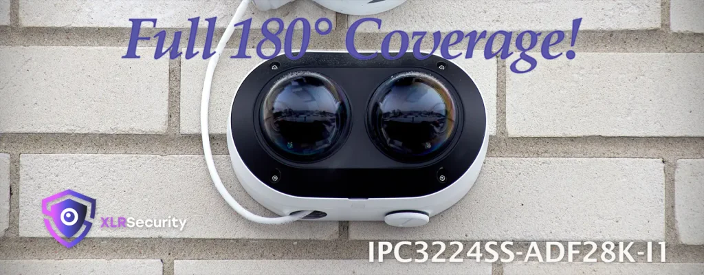 Dual lens security camera mounted on a brick wall