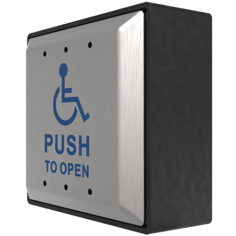 A side angle of a disability push to open metal button for wheelchair accessible doors.